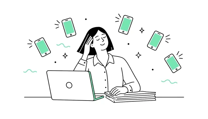 Illustration: Person am Schreibtisch, umgeben von klingelnden Telefonen
